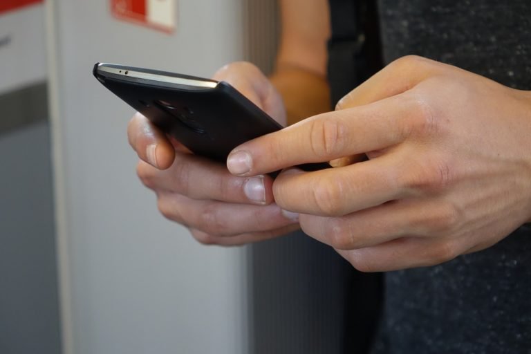 smartphone hands tap 2454611 IVR Meaning